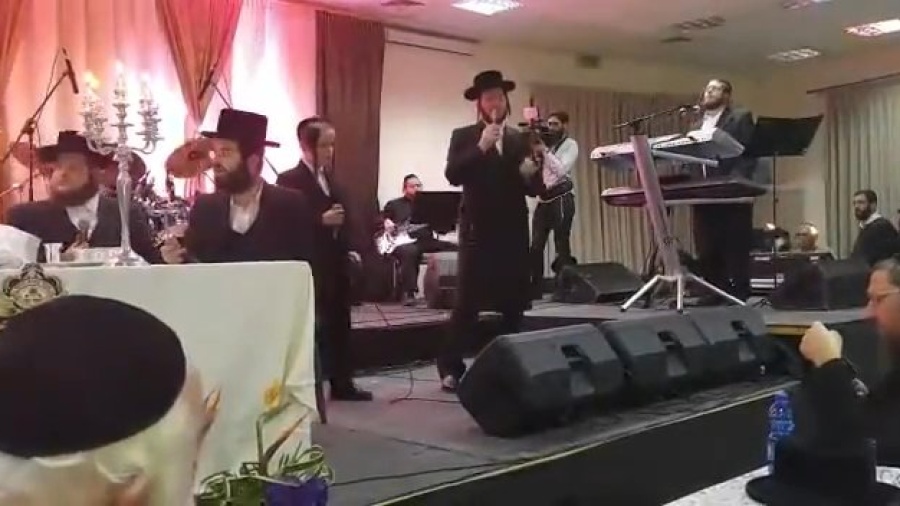 Motty Ilowitz singing his hit composition "B'chul tzar" - with Israel's wonder-child David Pollak