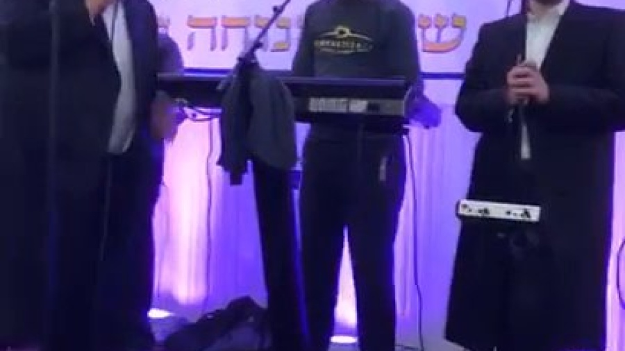 Michoel schnitzler rocking "boche"at a chesed 24/7 event, with stern productions, and zemiros choir.