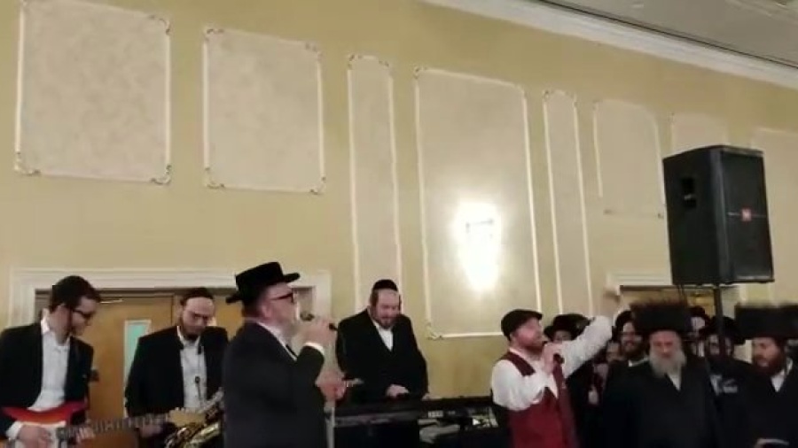 Michoel schnitzler and rafi the king rocking at a wedding in Monsey!