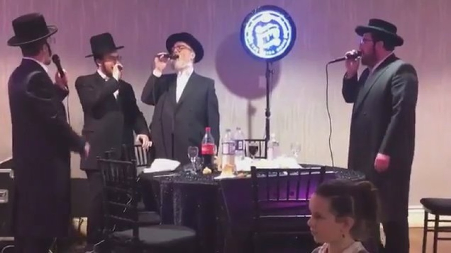 Michoel schnitzler singing at a bar mitzvah in Boro park. With the shira choir and moshe glick